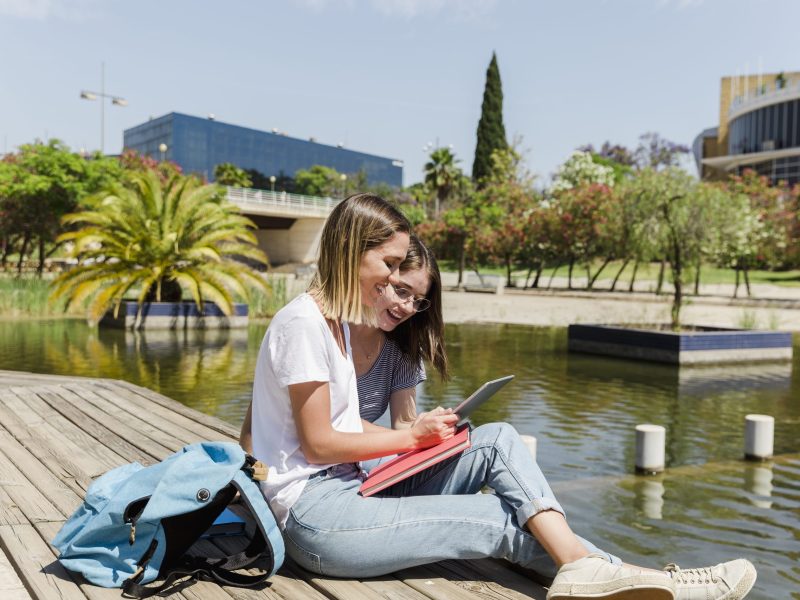 young-women-with-tablet-park